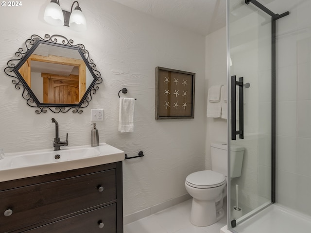 bathroom with vanity, an enclosed shower, and toilet