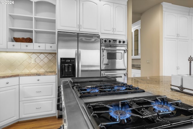 kitchen featuring appliances with stainless steel finishes and white cabinets