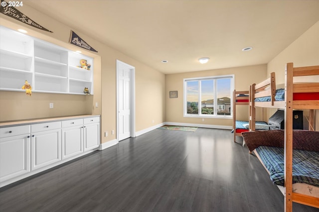 bedroom featuring dark hardwood / wood-style flooring