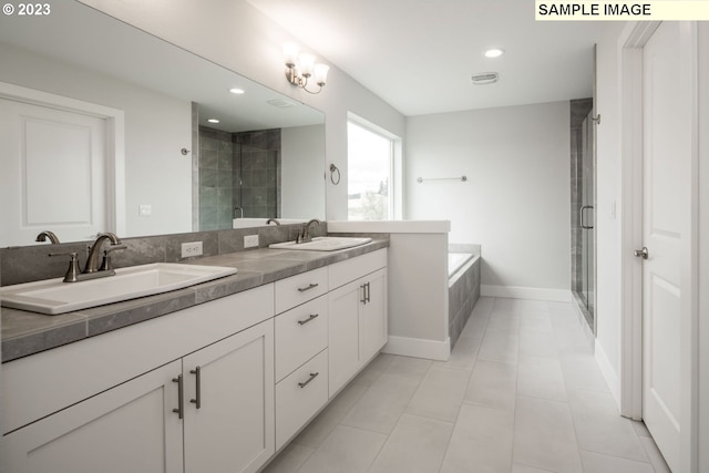 bathroom featuring dual sinks, plus walk in shower, tile flooring, a notable chandelier, and large vanity