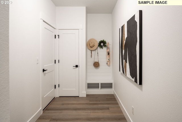 corridor featuring dark hardwood / wood-style floors