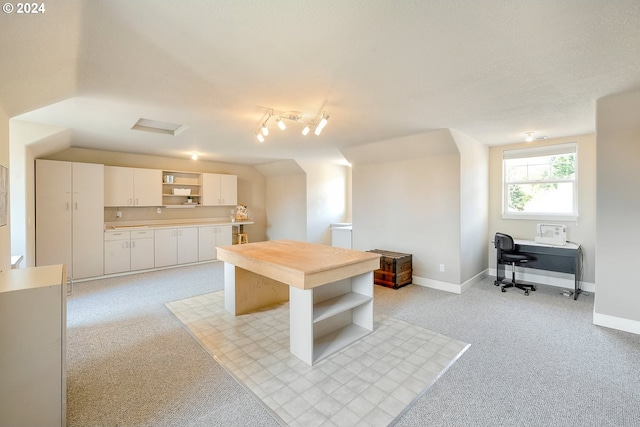 interior space featuring white cabinetry