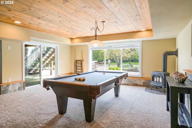 playroom with billiards, carpet floors, a raised ceiling, a wood stove, and wooden ceiling