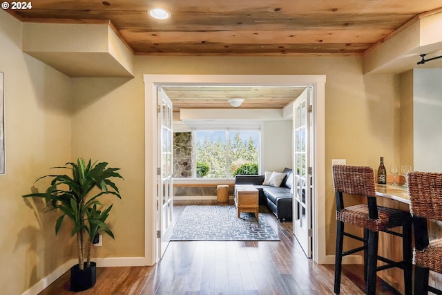 interior space featuring wooden ceiling and dark hardwood / wood-style flooring