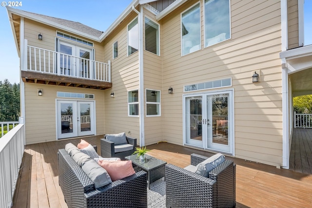 wooden terrace featuring outdoor lounge area and french doors