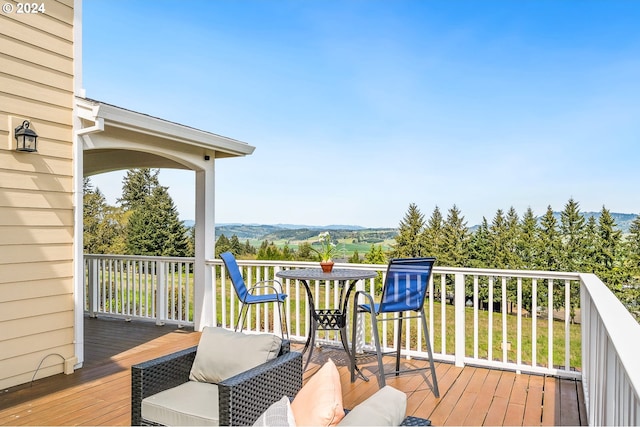 wooden terrace featuring a mountain view