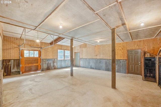 interior space featuring wooden walls