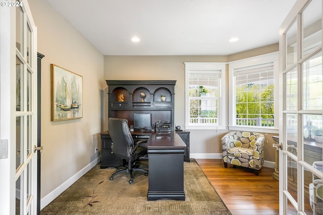 office area with french doors and dark wood-type flooring