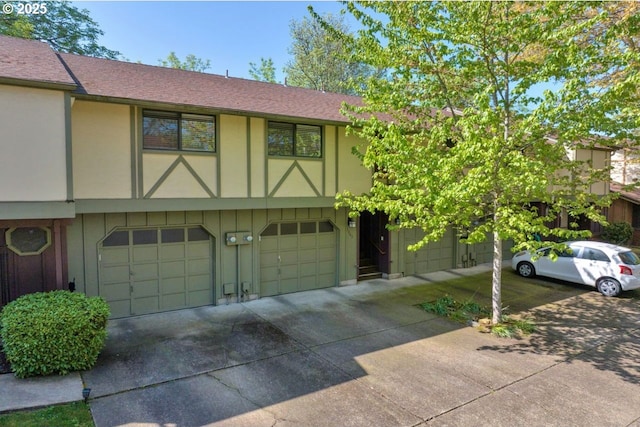 1361 City View St, Eugene, OR 97402 - view of property featuring driveway, an attached garage, and a shingled roof