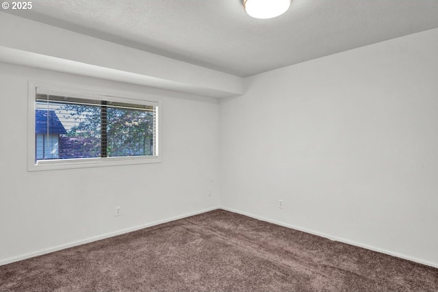 1361 City View St, Eugene, OR 97402 - empty room with carpet flooring, baseboards, and a textured ceiling