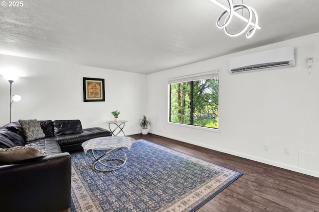 1361 City View St, Eugene, OR 97402 - living room with an AC wall unit, baseboards, dark wood-type flooring, and a chandelier