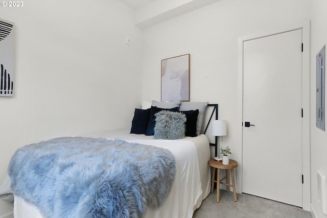 bedroom featuring light colored carpet