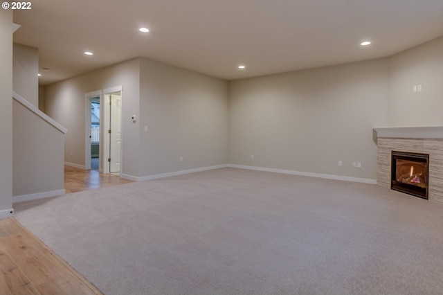 3012 S Nectarine, Cornelius, OR 97113 - unfurnished living room with light carpet, recessed lighting, baseboards, and a fireplace