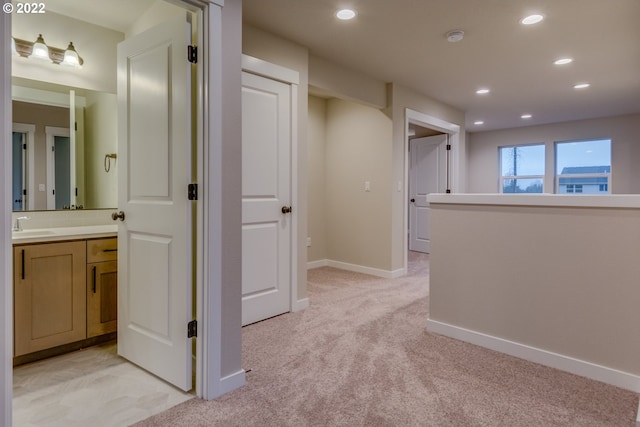 3012 S Nectarine, Cornelius, OR 97113 - hallway featuring light colored carpet, recessed lighting, baseboards, and a sink