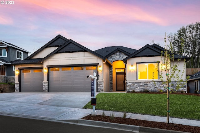 view of front of property with a garage, concrete driveway, stone siding, a front lawn, and board and batten siding