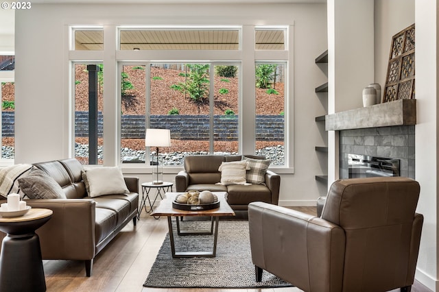 interior space with baseboards and wood finished floors