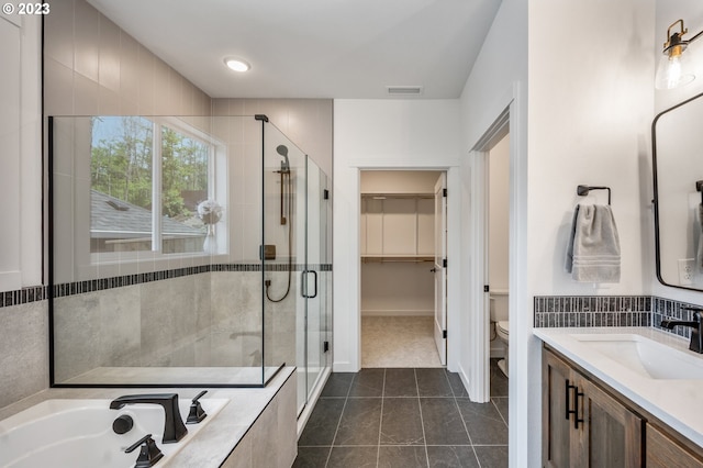 bathroom featuring visible vents, toilet, tile patterned flooring, a shower stall, and a bath