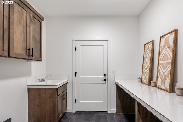 clothes washing area with a sink