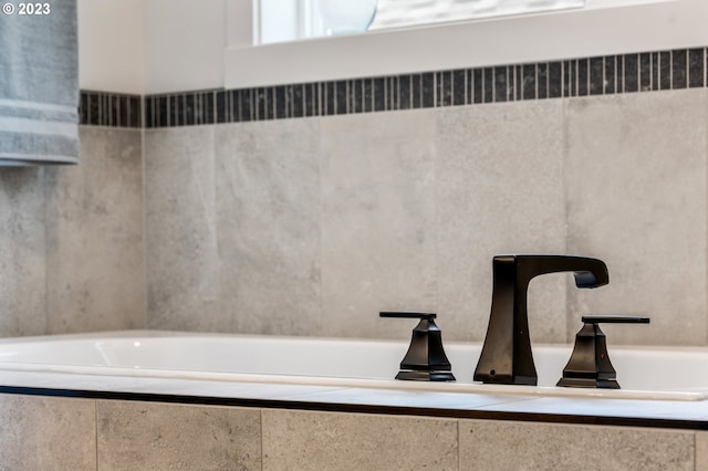 interior details featuring tiled bath