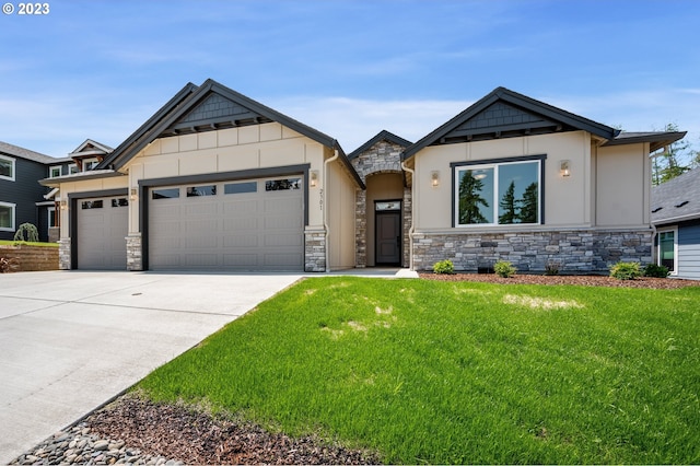 view of front of property with an attached garage, driveway, stone siding, a front lawn, and board and batten siding