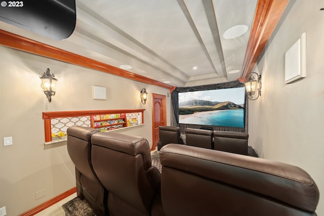 home theater featuring a raised ceiling