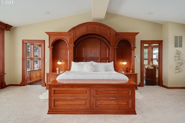 bedroom with light carpet and lofted ceiling