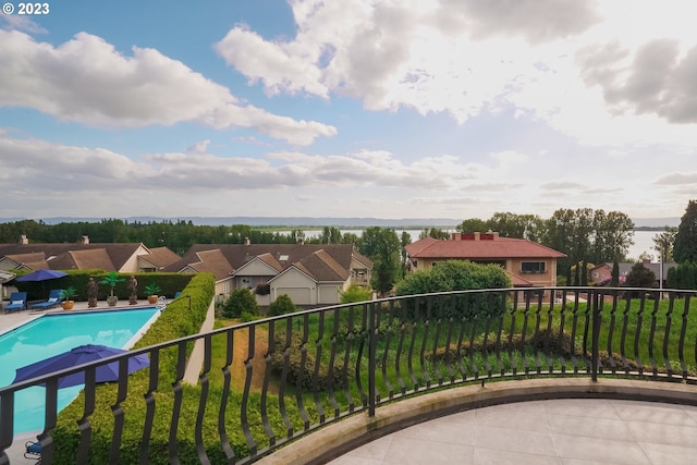 balcony with a fenced in pool