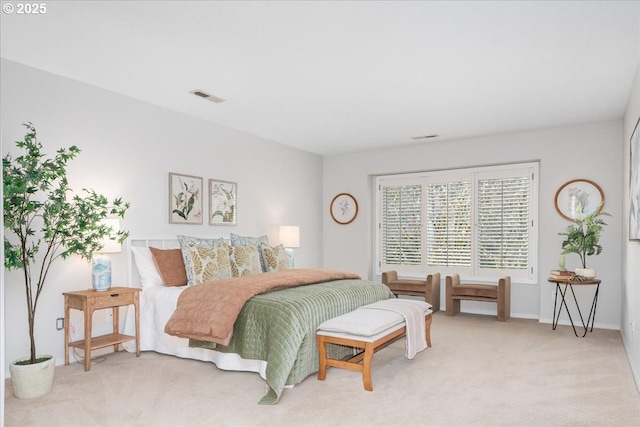 bedroom with visible vents and light colored carpet