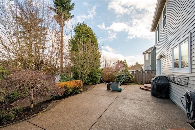 view of patio featuring fence