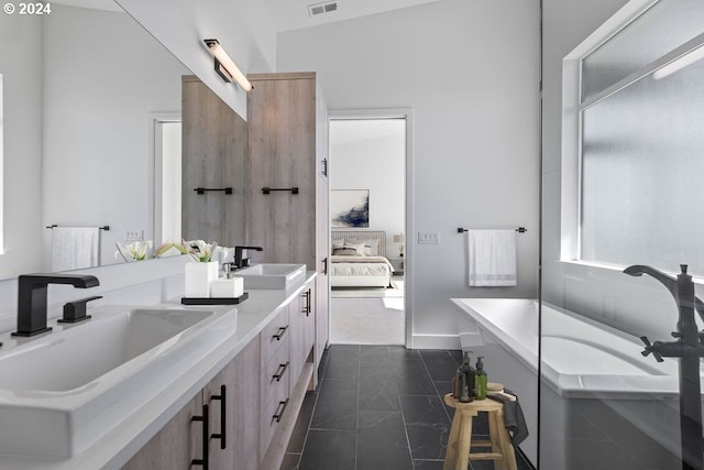 bathroom featuring vanity and a bathtub