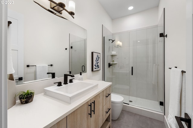 bathroom featuring vanity, toilet, walk in shower, and tile patterned floors