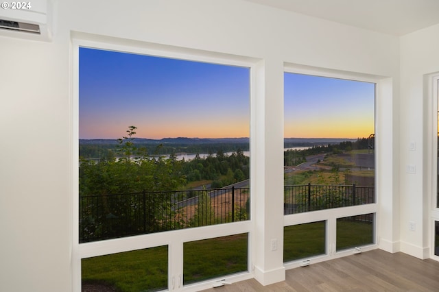 sunroom with a wall mounted air conditioner