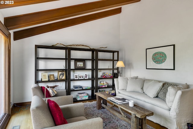 living room featuring hardwood / wood-style floors and lofted ceiling with beams