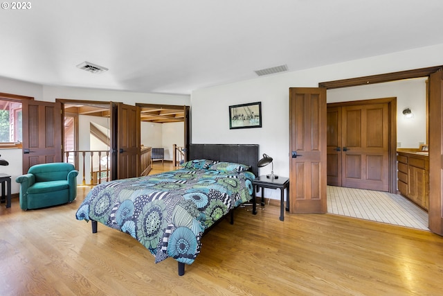 bedroom with light hardwood / wood-style floors