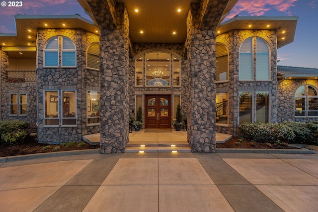 exterior entry at dusk with french doors