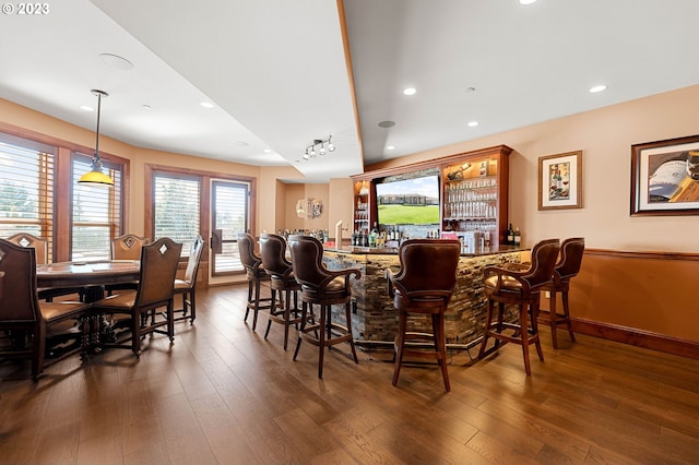 dining area with dark hardwood / wood-style flooring