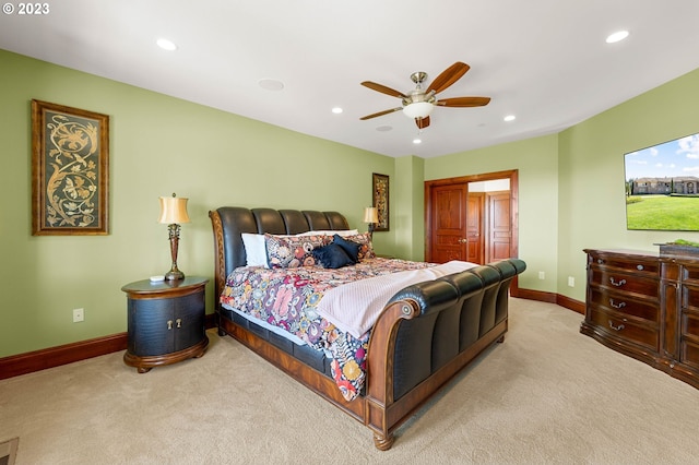 carpeted bedroom with ceiling fan