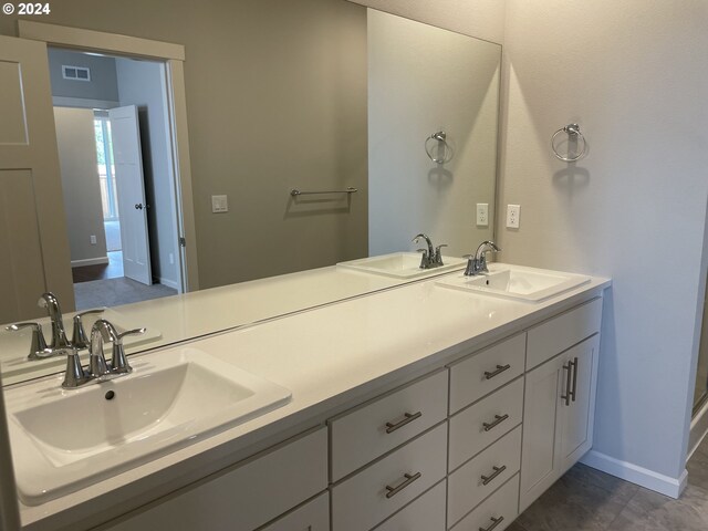 bathroom featuring tile patterned floors and a shower with shower door