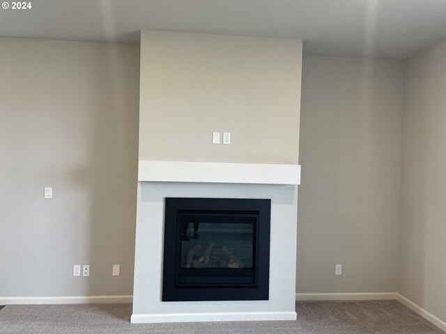 unfurnished living room featuring dark hardwood / wood-style flooring