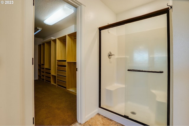 bathroom with tile floors and an enclosed shower