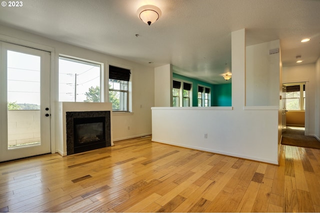 unfurnished living room featuring light hardwood / wood-style floors