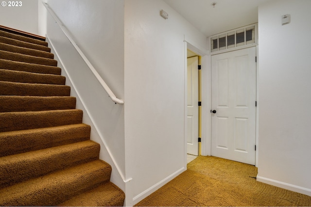 stairs with light colored carpet