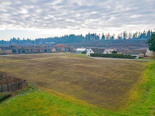 birds eye view of property with a rural view