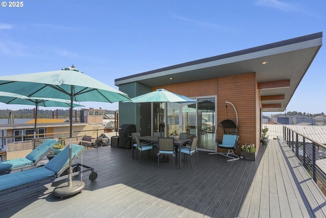 2901 NE Marine Dr Unit C-23, Portland, OR 97211 - wooden terrace featuring outdoor dining area