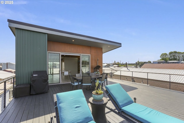 2901 NE Marine Dr Unit C-23, Portland, OR 97211 - wooden terrace featuring a grill and outdoor dining area