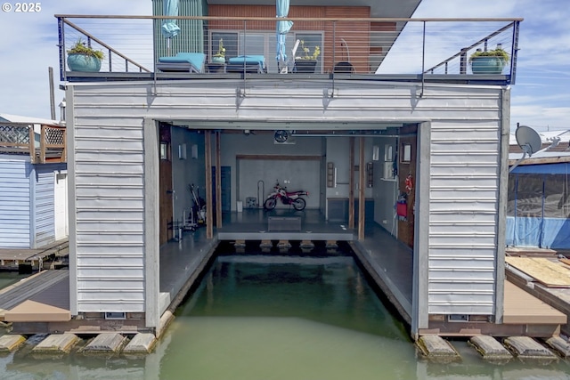 2901 NE Marine Dr Unit C-23, Portland, OR 97211 - back of property featuring a water view and a garage