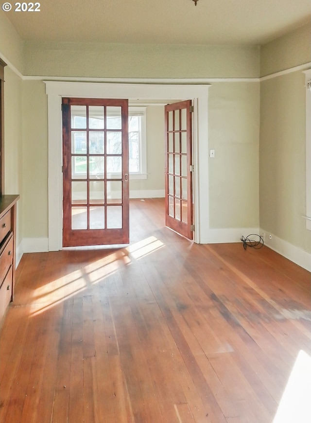 empty room with light hardwood / wood-style floors