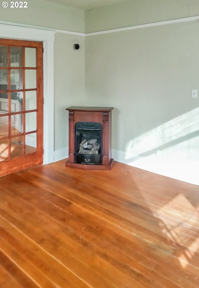 unfurnished living room with hardwood / wood-style flooring