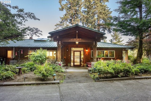 33423 Timber Ln, Eugene, OR 97405 - doorway to property with a standing seam roof, a metal roof, a chimney, and driveway