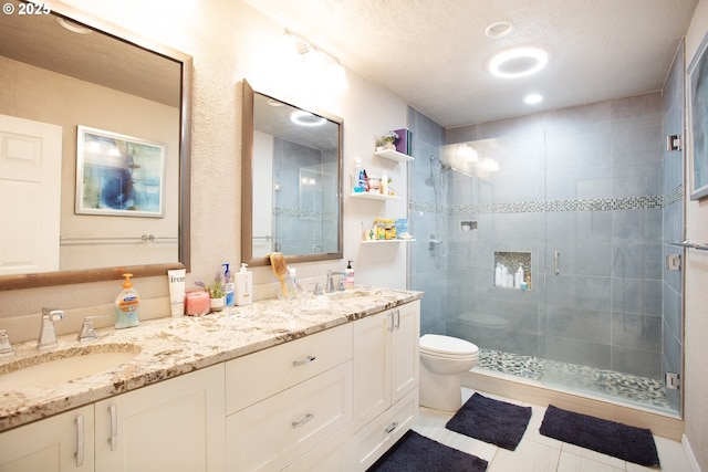 33423 Timber Ln, Eugene, OR 97405 - full bathroom featuring a stall shower, double vanity, a textured ceiling, and tile patterned floors